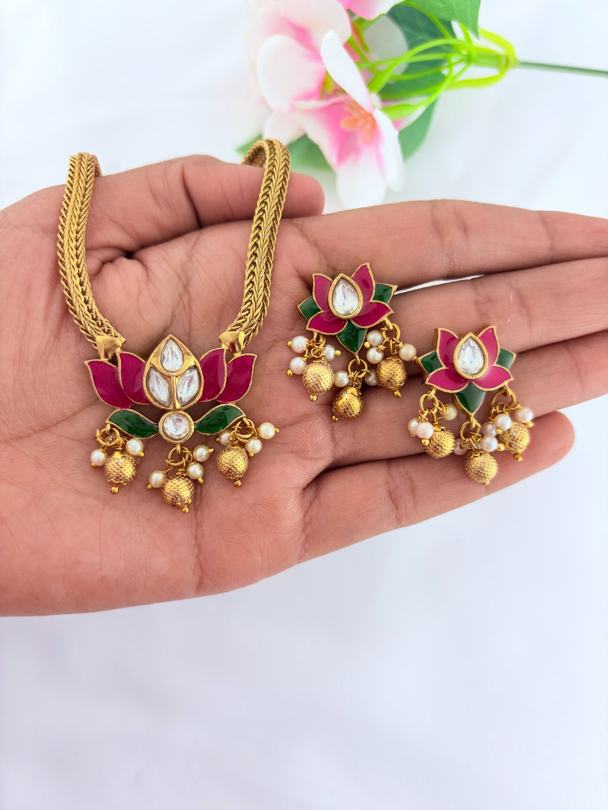 Premium lotus motif neckset highlighted with golden beads and enamel work