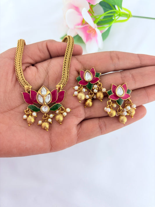 Premium lotus motif neckset highlighted with golden beads and enamel work
