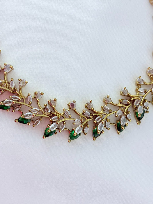 Classic CZ stone necklace featuring a refined antique finish with matching earrings