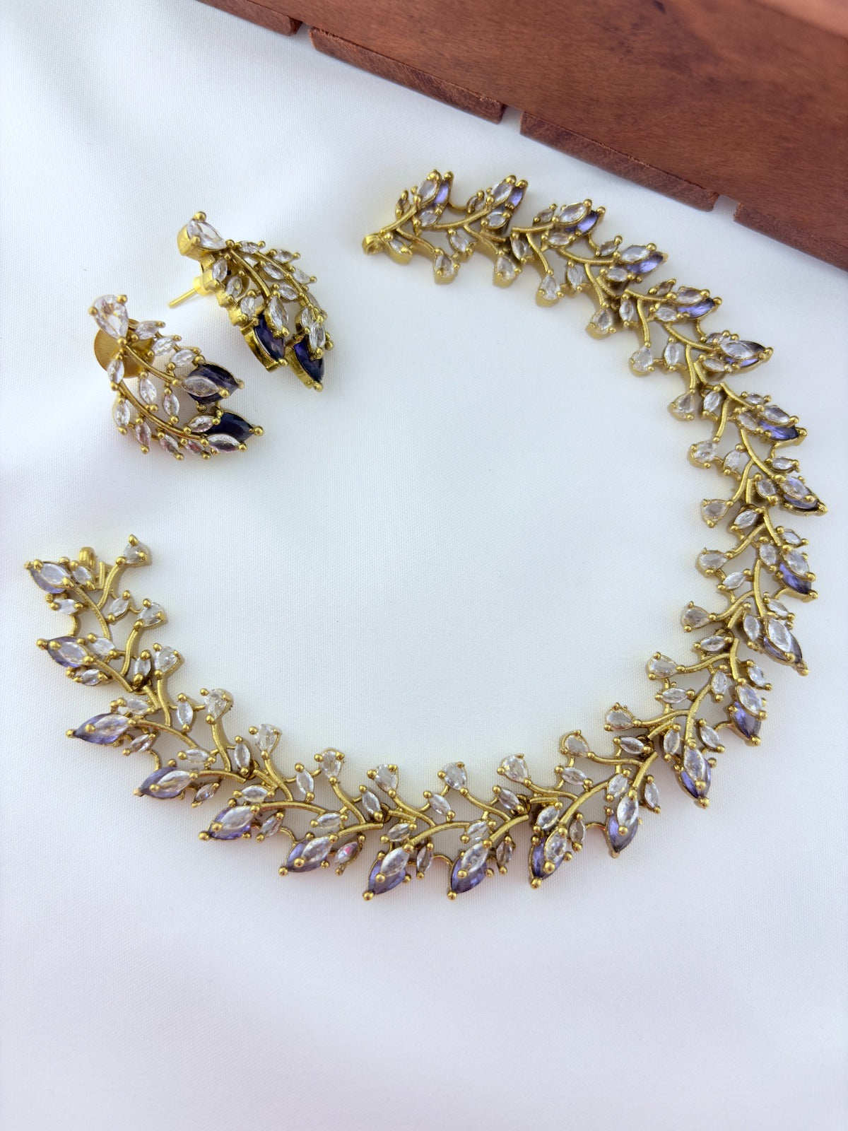 Classic CZ stone necklace featuring a refined antique finish with matching earrings