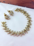 Classic CZ stone necklace featuring a refined antique finish with matching earrings