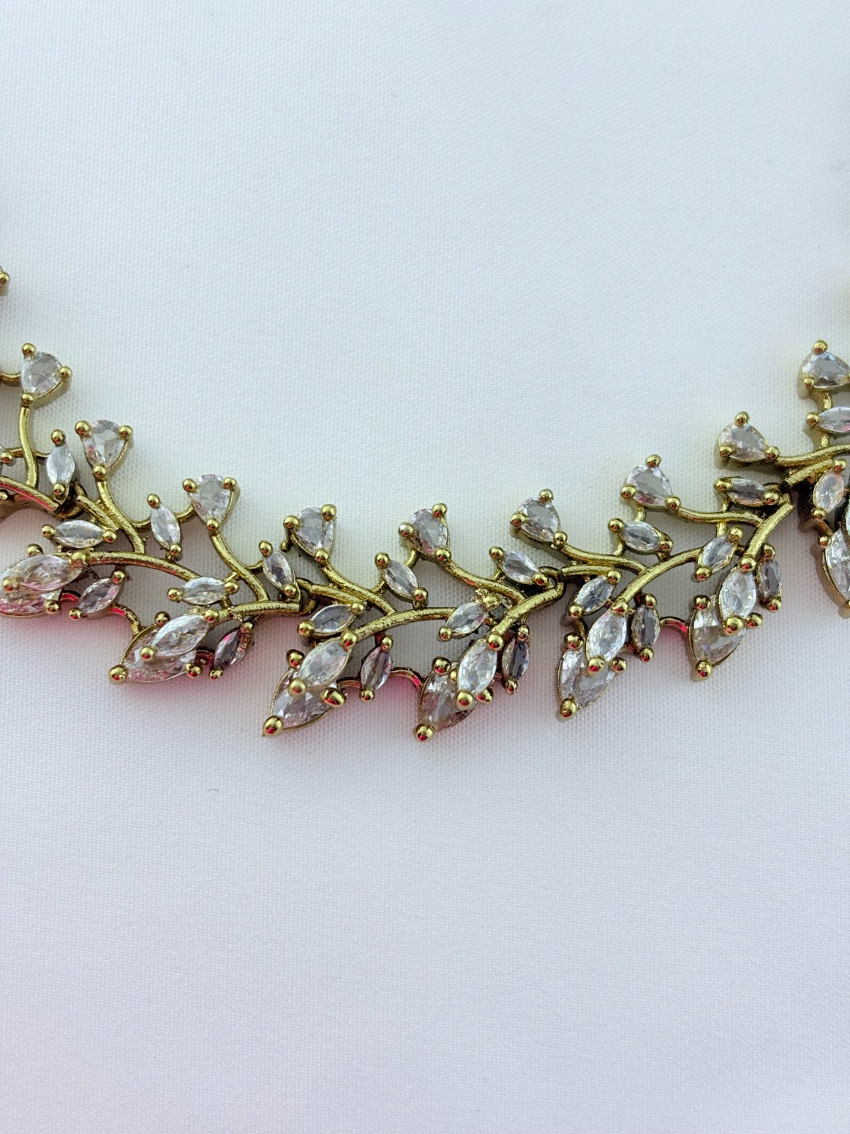 Classic CZ stone necklace featuring a refined antique finish with matching earrings