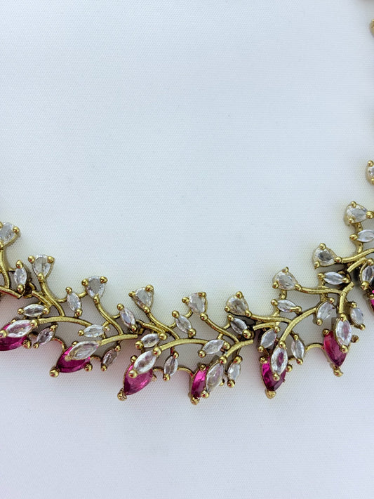 Classic CZ stone necklace featuring a refined antique finish with matching earrings