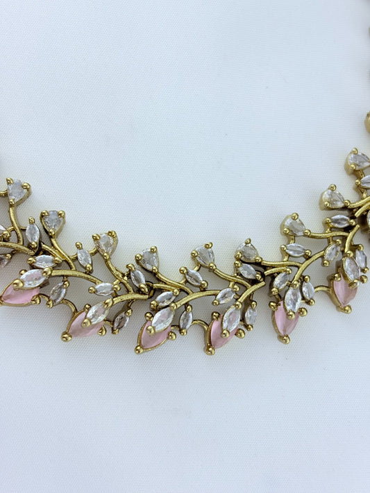 Classic CZ stone necklace featuring a refined antique finish with matching earrings