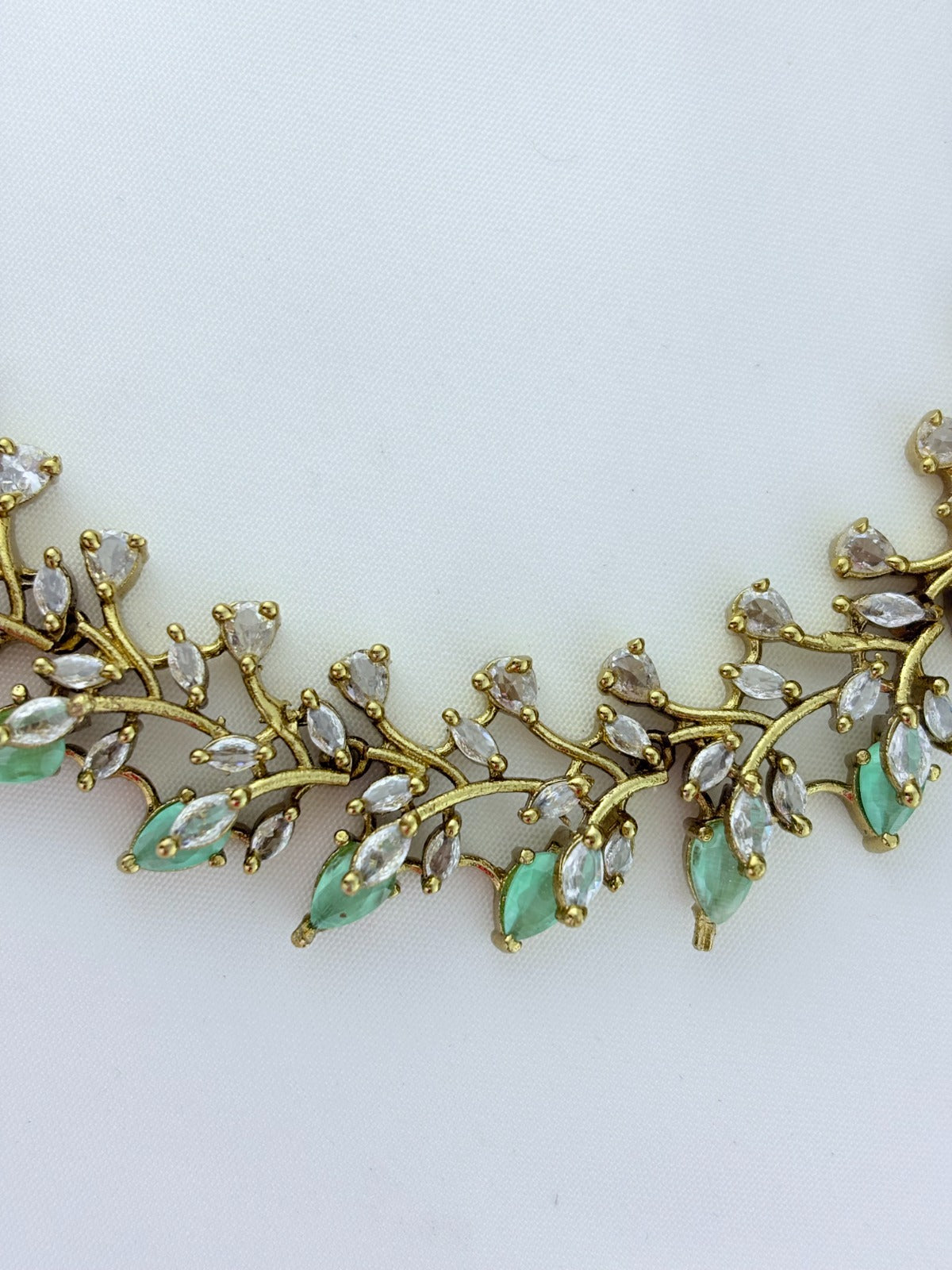 Classic CZ stone necklace featuring a refined antique finish with matching earrings