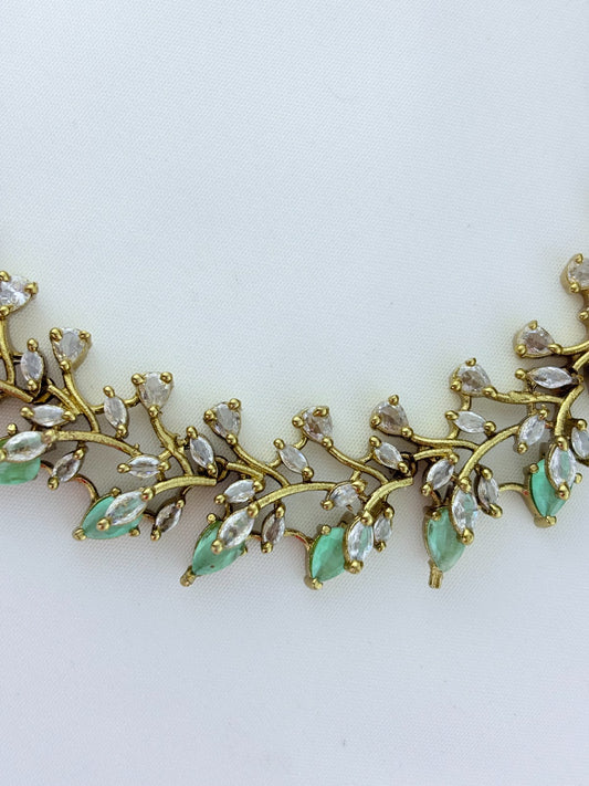 Classic CZ stone necklace featuring a refined antique finish with matching earrings