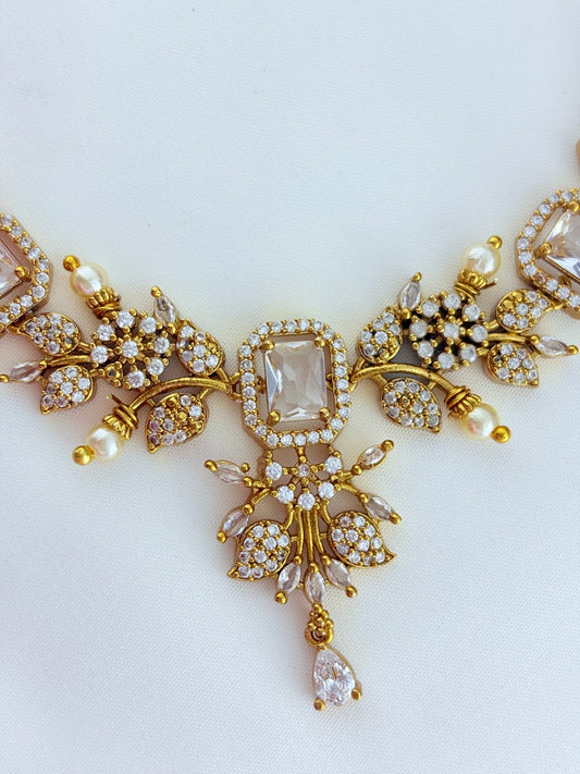 Premium matte finish neckset beautifully designed with pearls and stones