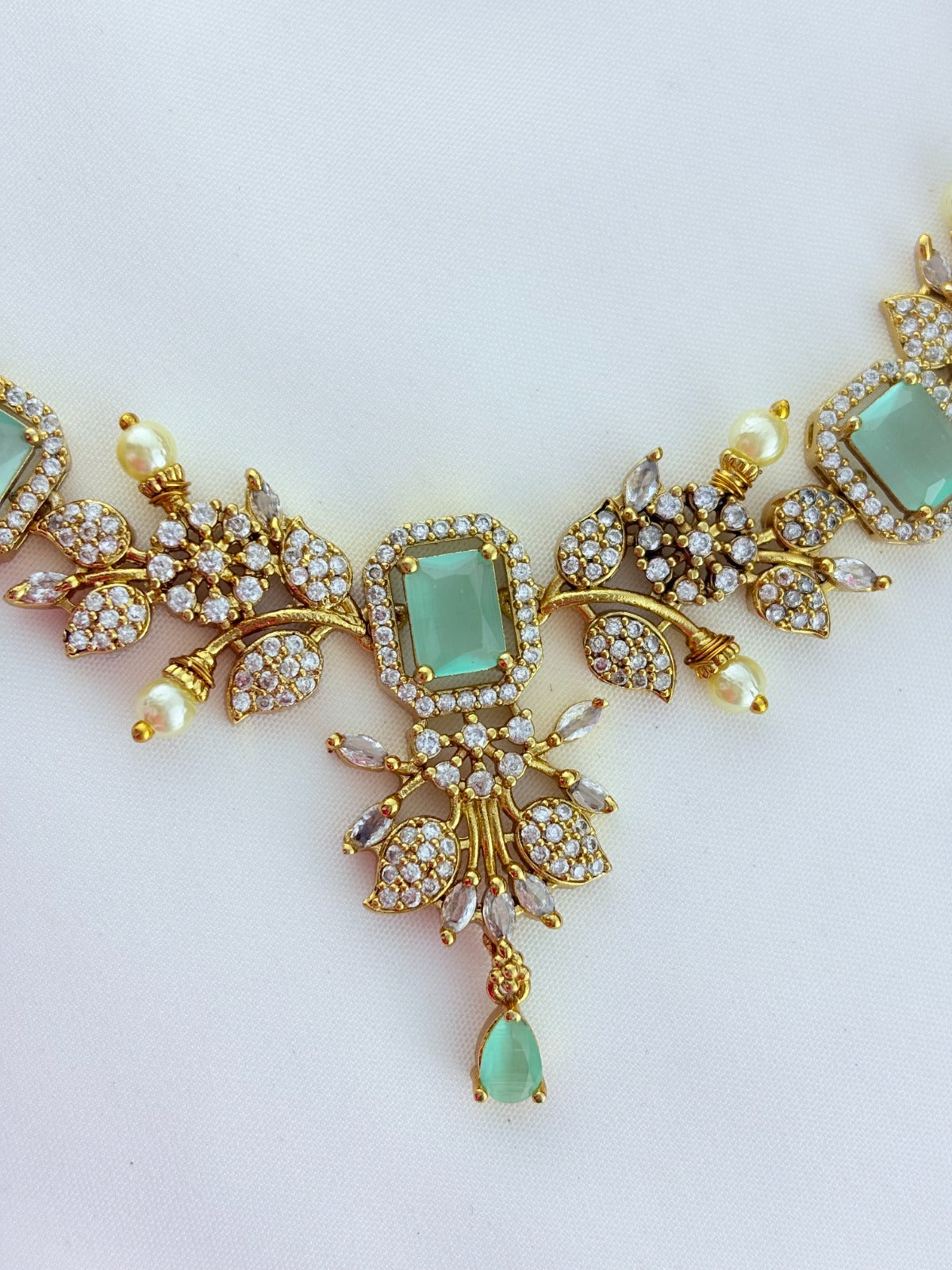 Premium matte finish neckset beautifully designed with pearls and stones