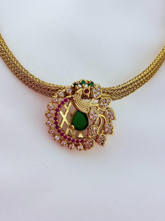 Elegant peacock motif pendant choker paired with matching earrings