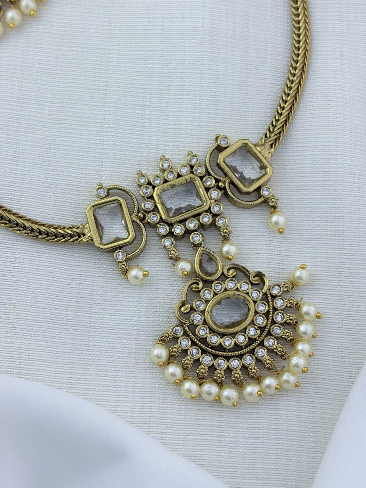 Traditional elegance added to a modern trendy style - Premium matte finish necklace and earrings adorned with classic stones and pearls