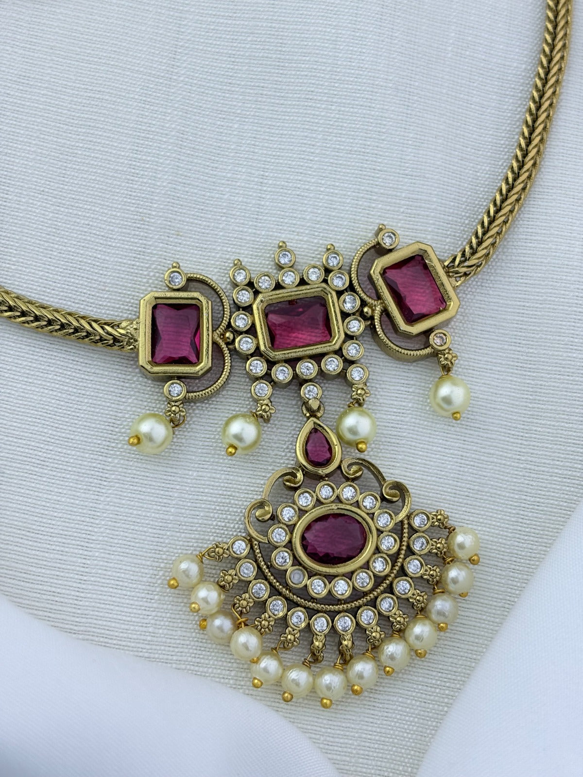 Traditional elegance added to a modern trendy style - Premium matte finish necklace and earrings adorned with classic stones and pearls