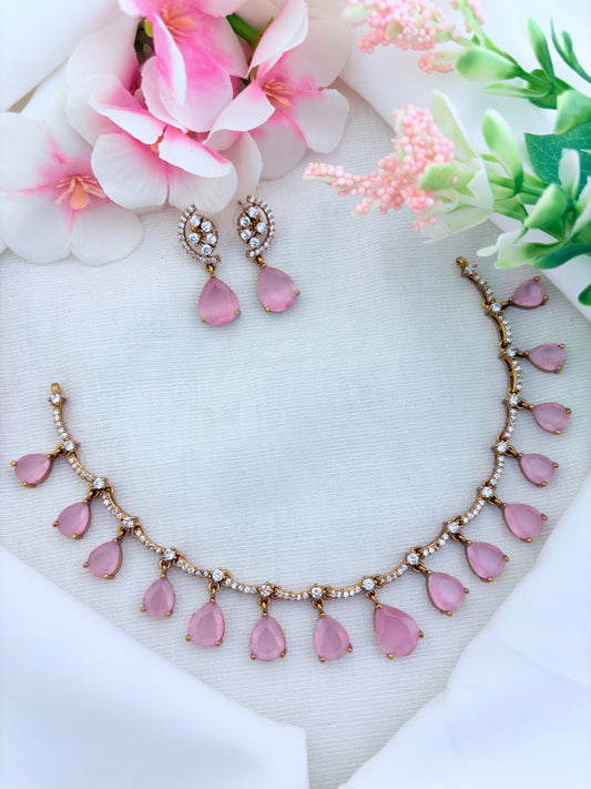 Style in modern tradition  - Premium matte finish necklace and earrings enhanced with classic stone drops