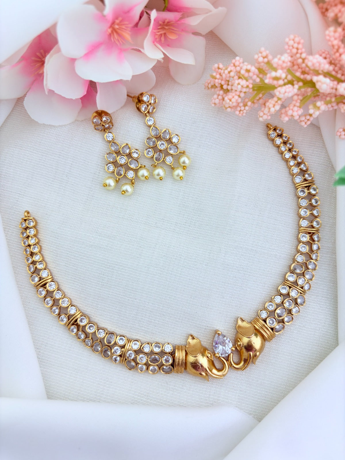 Elegant CZ stone necklace featuring a finely crafted elephant motif with matching earrings