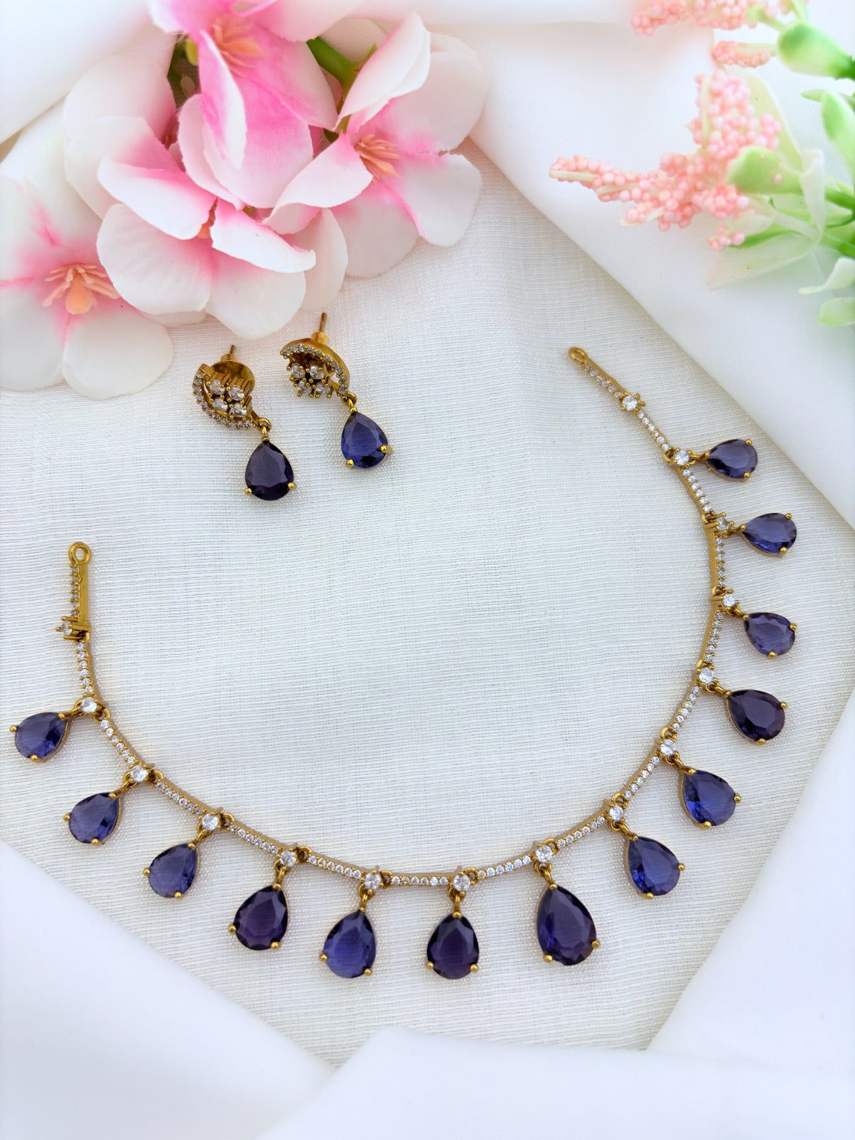 Style in modern tradition  - Premium matte finish necklace and earrings enhanced with classic stone drops