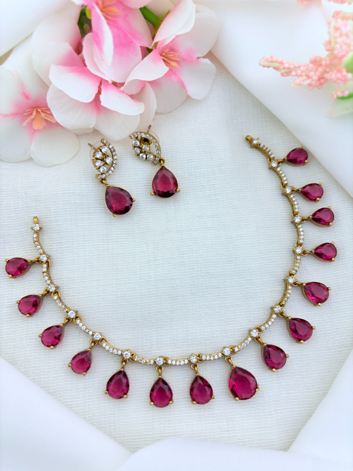 Style in modern tradition  - Premium matte finish necklace and earrings enhanced with classic stone drops