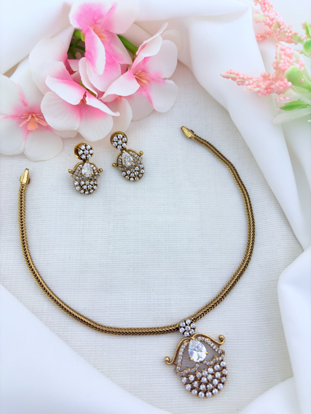 Premium matte finish necklace and earrings adorned with classic AD stones