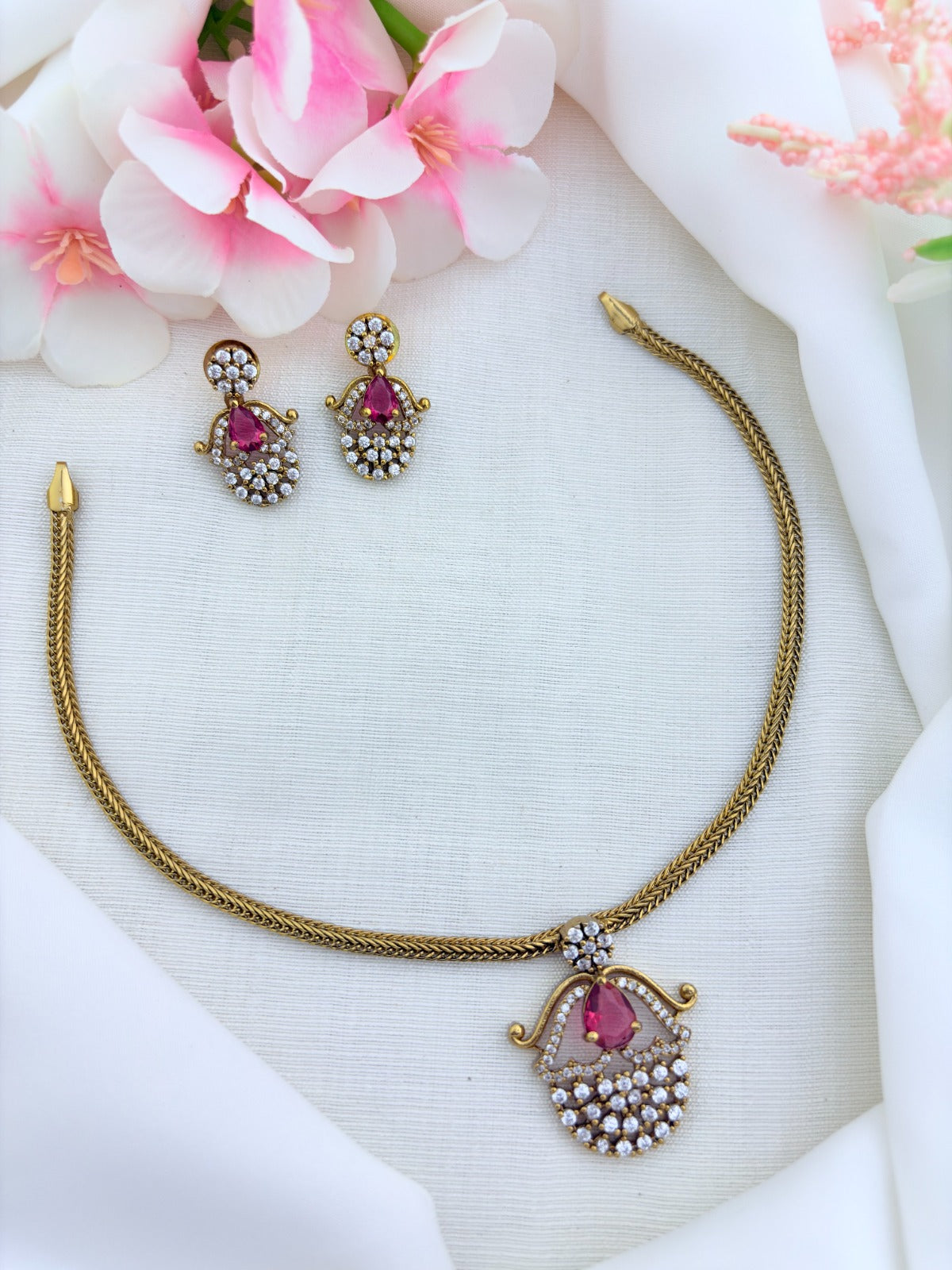 Premium matte finish necklace and earrings adorned with classic AD stones