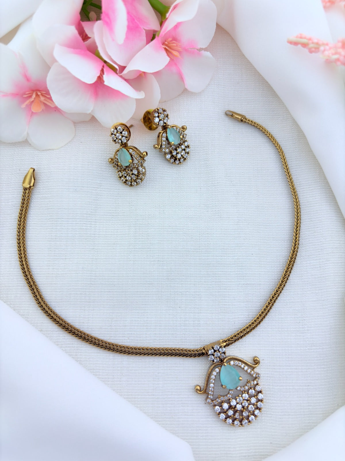 Premium matte finish necklace and earrings adorned with classic AD stones