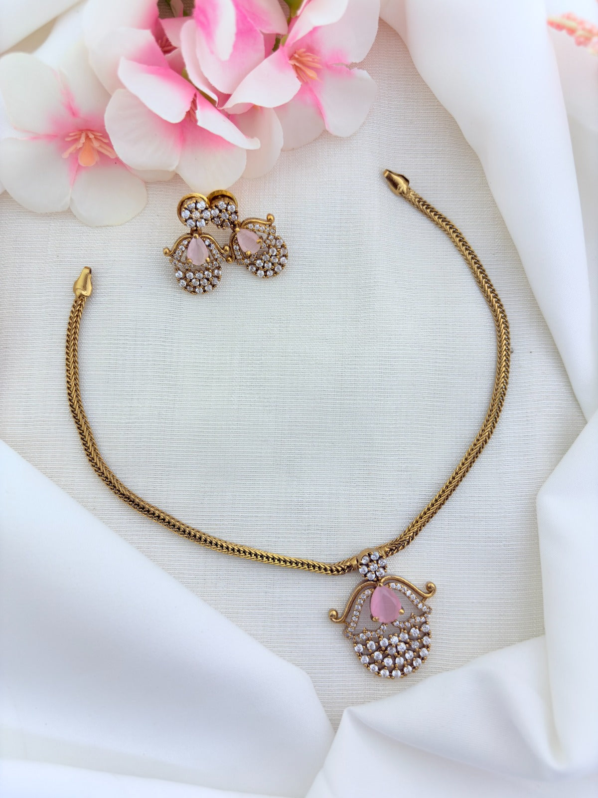 Premium matte finish necklace and earrings adorned with classic AD stones