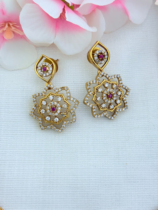 Classic attigai pattern reimagined in modern elegance with AD  stone floral pendant and matching earrings