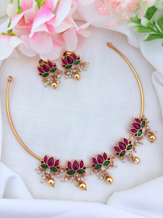 Traditionally crafted louts-motif hasli neckset in premium matte finish, highlighted with golden and pearl drops