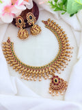 Elegant matte finish neckset featuring a peacock motif, pearl drops and matching jhumka