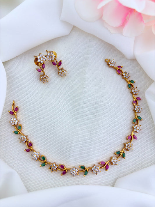 Premium matte finish neckset featuring floral and leaf motifs in a single design, adorned with AD & CZ stones and matching earrings