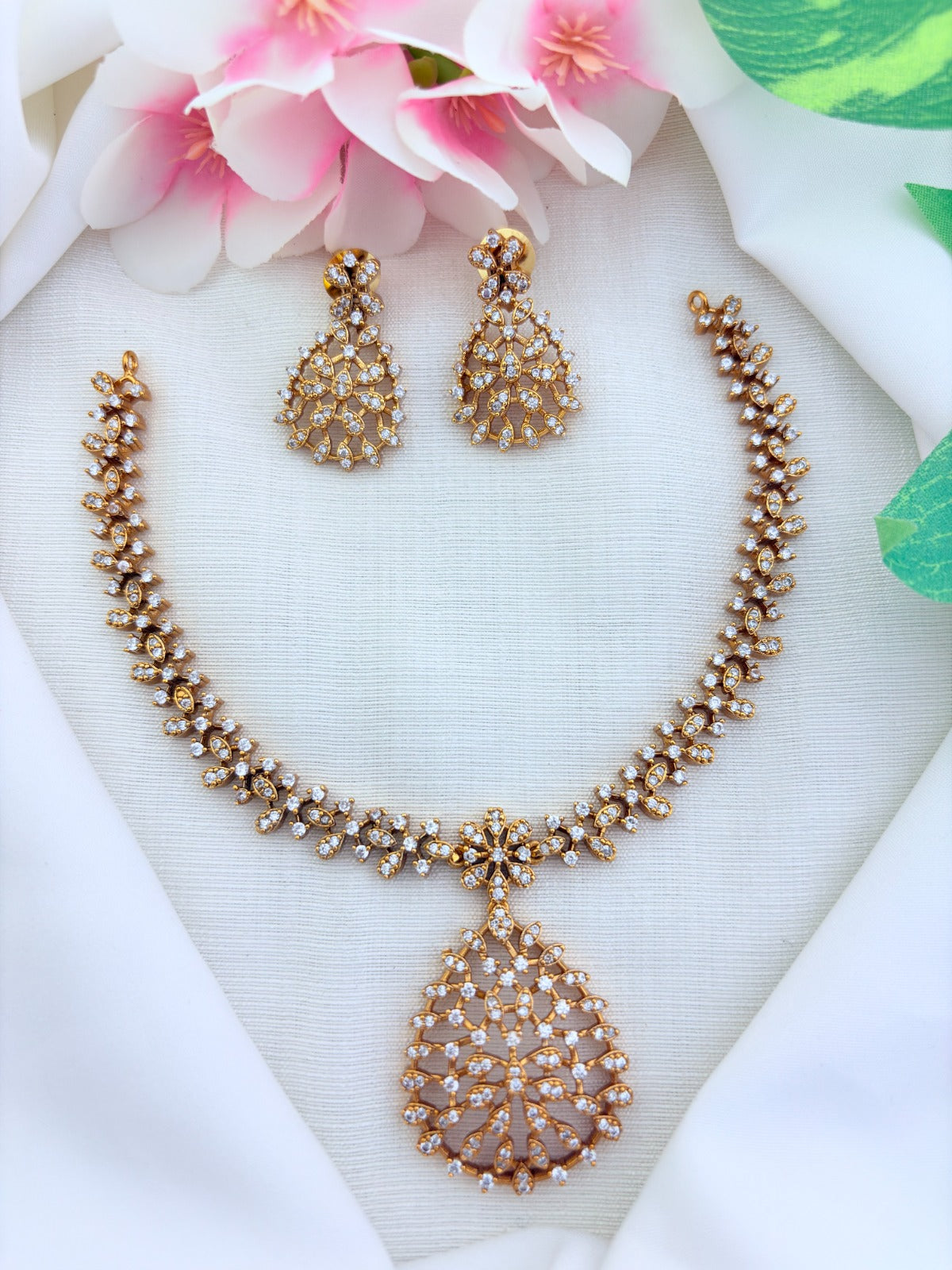 Style in modern tradition - Premium matte finish necklace and earrings beautifully crafted with AD stones