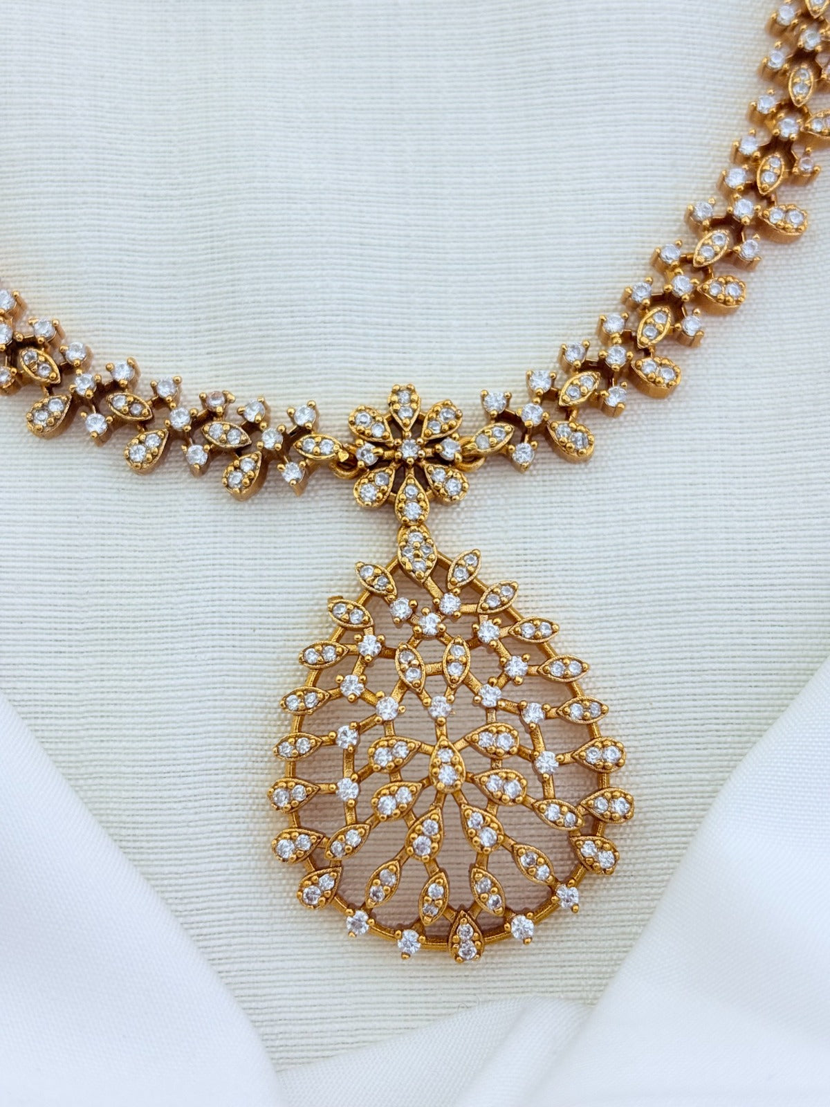 Style in modern tradition - Premium matte finish necklace and earrings beautifully crafted with AD stones