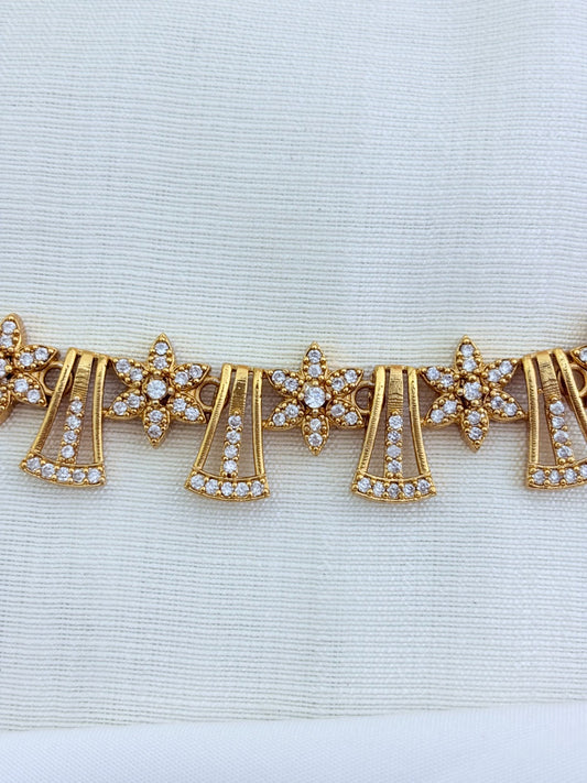 Premium matte finish necklace featuring a floral pattern adorned wih AD stones