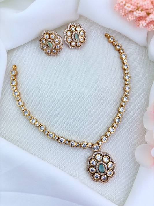 Classic matte finish floral pendant necklace and earrings  adorned with  CZ stones