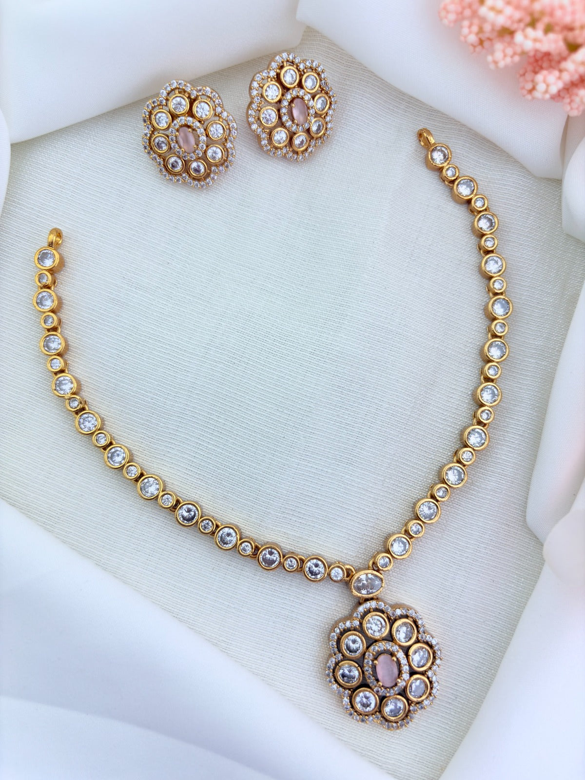 Classic matte finish floral pendant necklace and earrings  adorned with  CZ stones