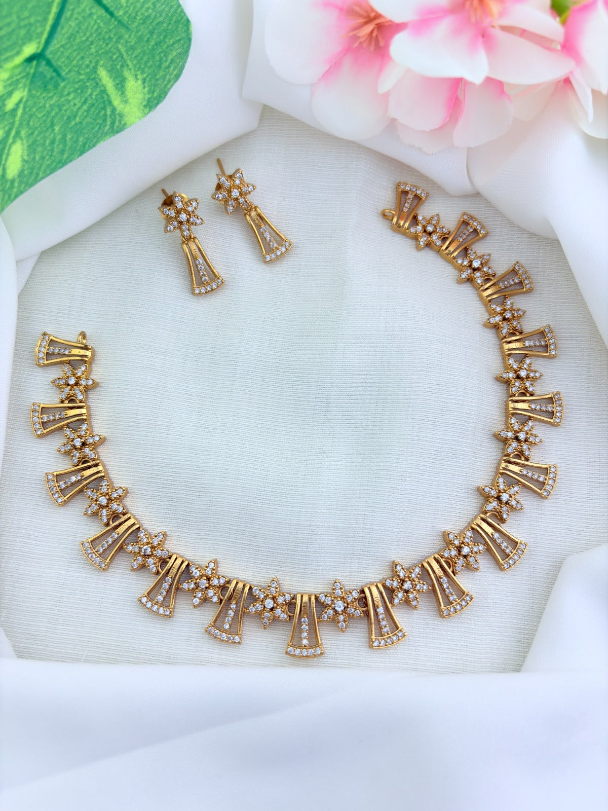 Premium matte finish necklace featuring a floral pattern adorned wih AD stones