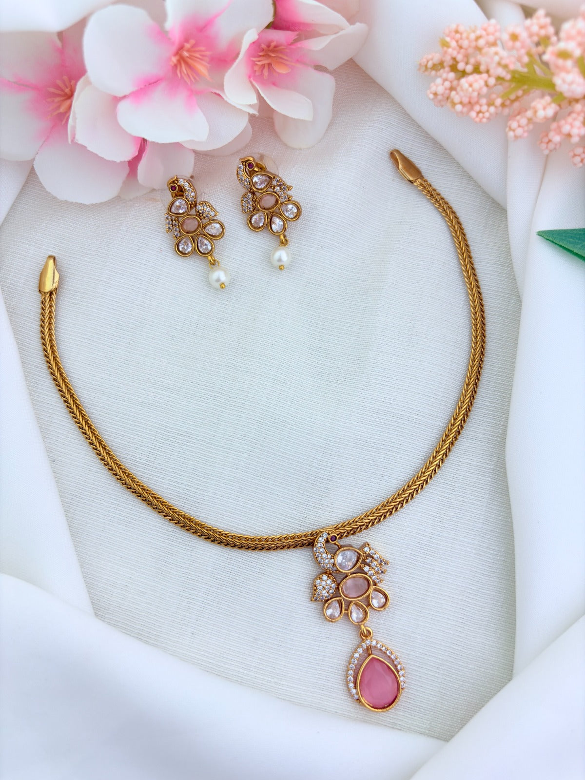 Elegant premium matte finish Peacock and floral pattern pendant beautifully adorned with classic AD stones