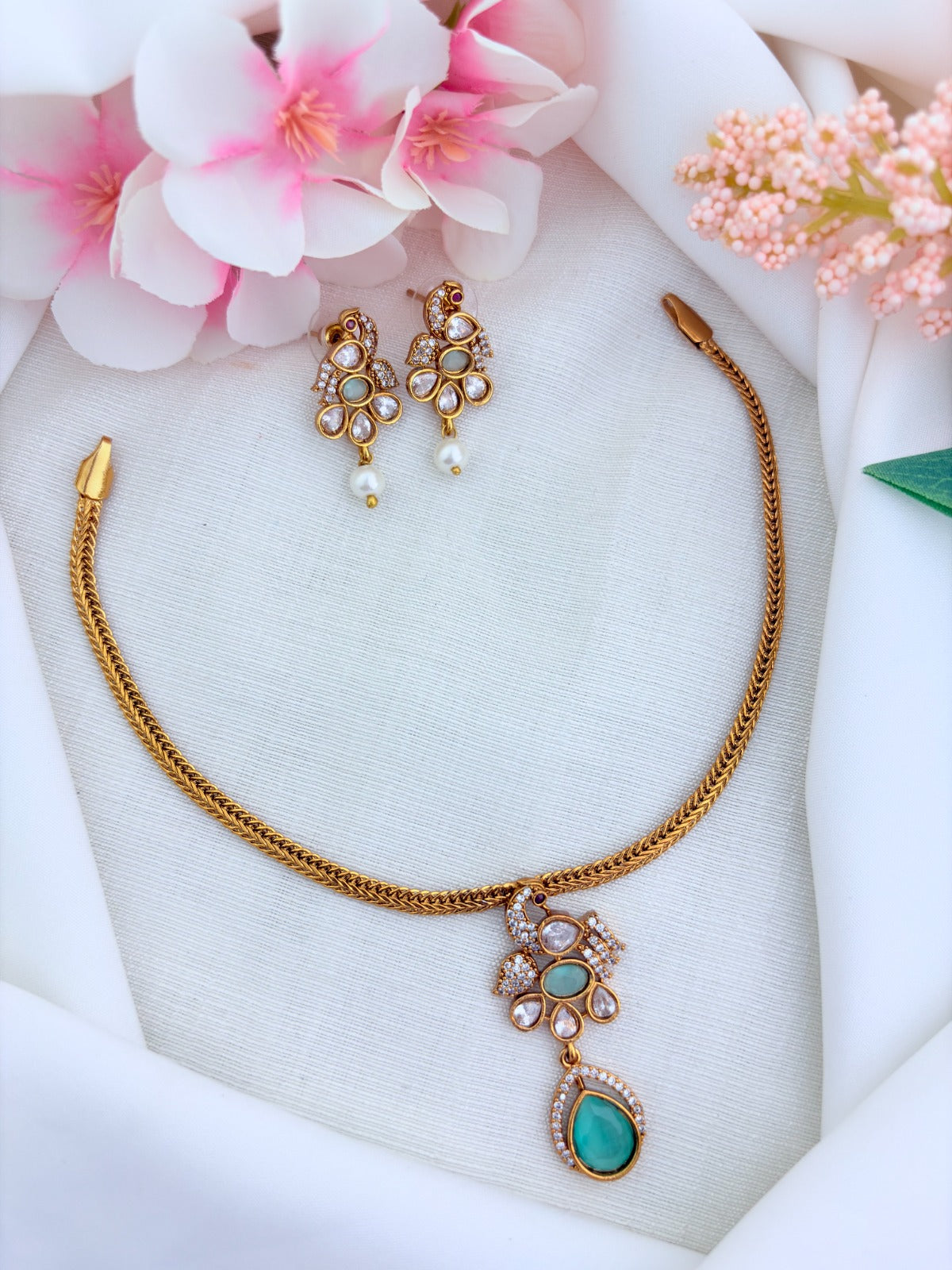 Elegant premium matte finish Peacock and floral pattern pendant beautifully adorned with classic AD stones