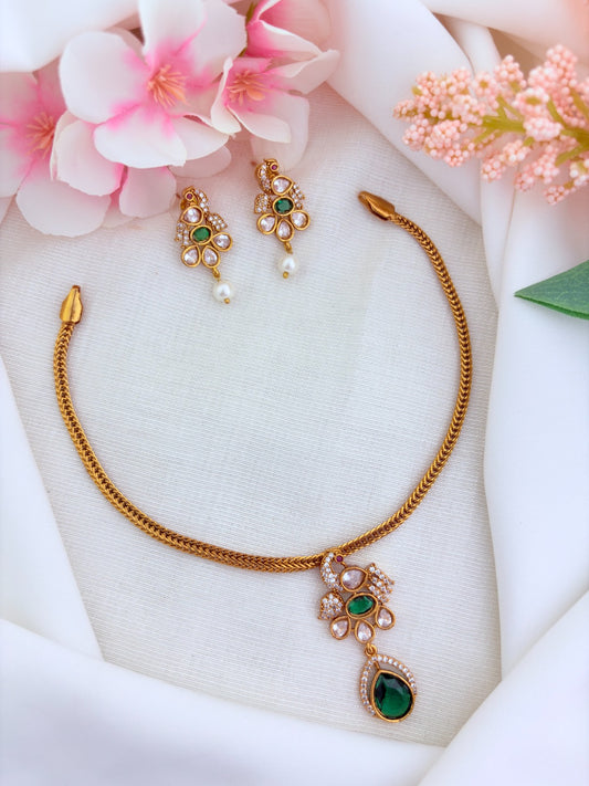 Elegant premium matte finish Peacock and floral pattern pendant beautifully adorned with classic AD stones