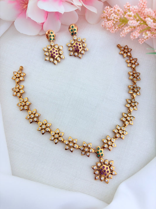 Traditional floral pattern necklace in premium matte finish beautifully crafted with AD stones