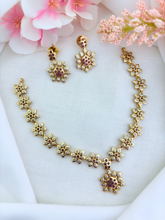Traditional floral pattern necklace in premium matte finish beautifully crafted with AD stones