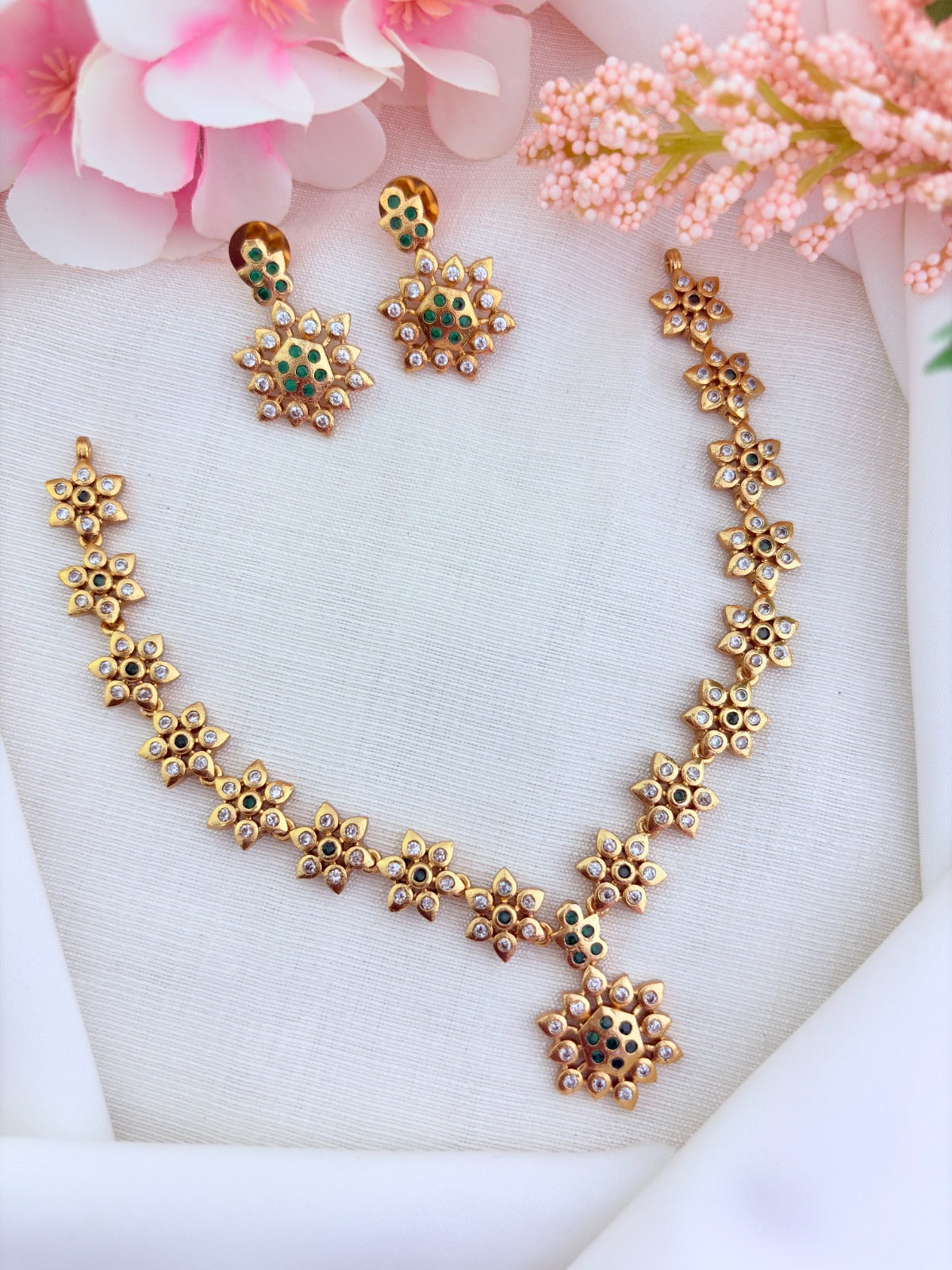 Traditional floral pattern necklace in premium matte finish beautifully crafted with AD stones