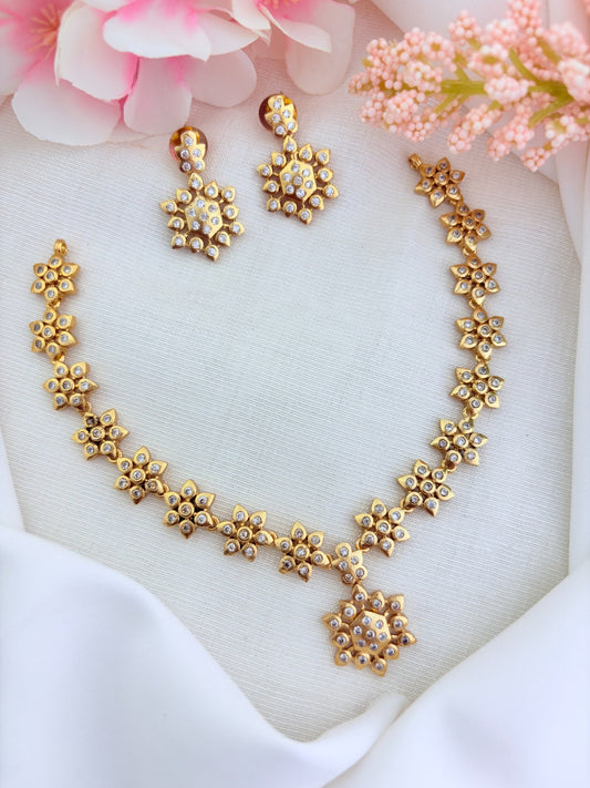 Traditional floral pattern necklace in premium matte finish beautifully crafted with AD stones