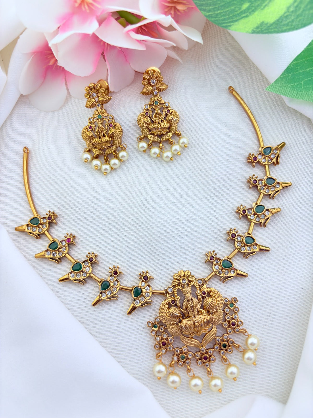 Classic premium matte finish peacock and lakshmi motif adorned with stones and pearl drops