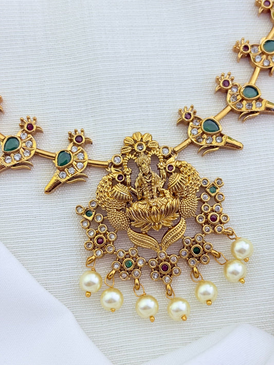 Classic premium matte finish peacock and lakshmi motif adorned with stones and pearl drops