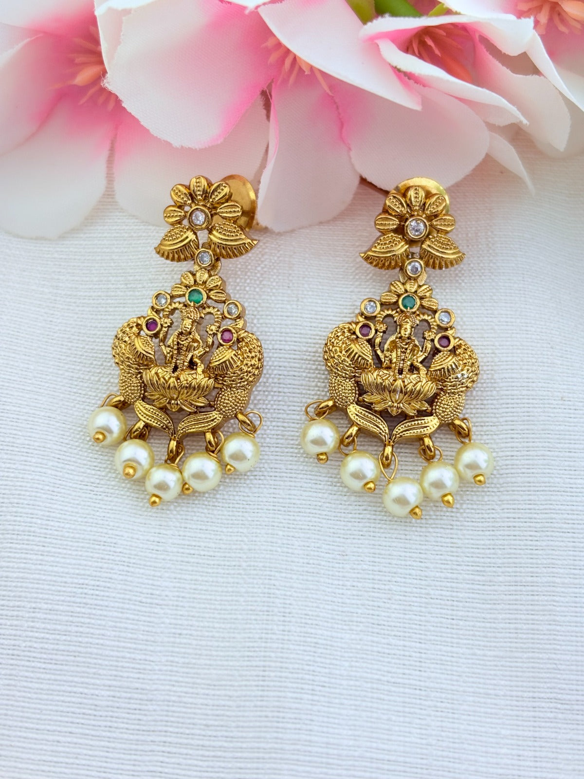 Classic premium matte finish peacock and lakshmi motif adorned with stones and pearl drops