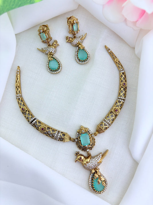Premium matte finish hasli neckset featuring a graceful peacock pendant, beautifully adorned with AD stones
