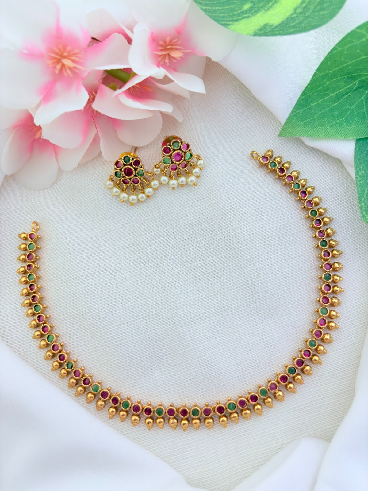 Premium matte finish AD stone necklace and earrings beautifully crafted with pearl drops