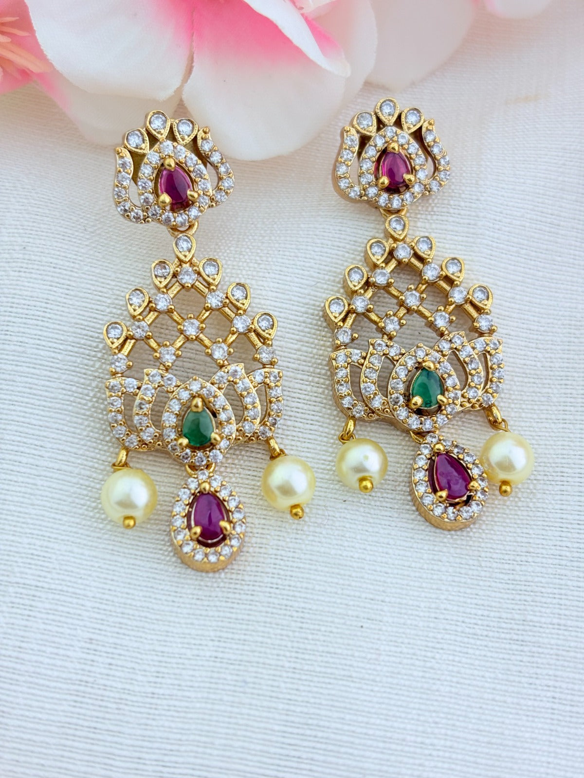 Classic lotus motif necklace adorned with AD stones and elegant pearl drops with matching earrings