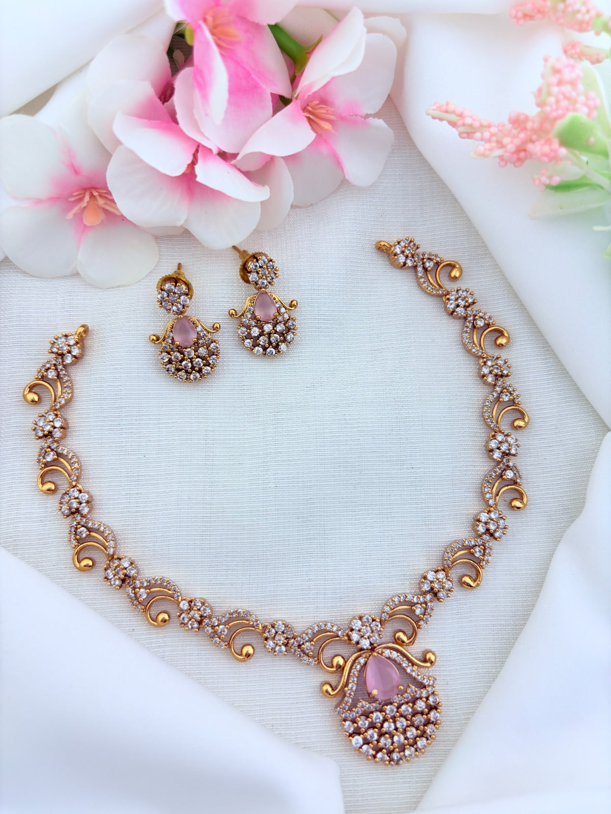 Elegant premium matte finish necklace and earrings adorned with classic AD stones