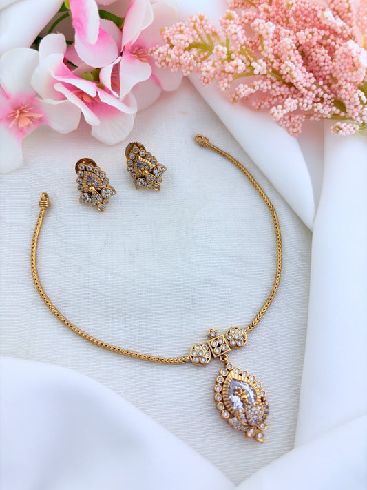 Beautifully crafted peacock pendant featuring AD stones in premium matte finish with matching earrings