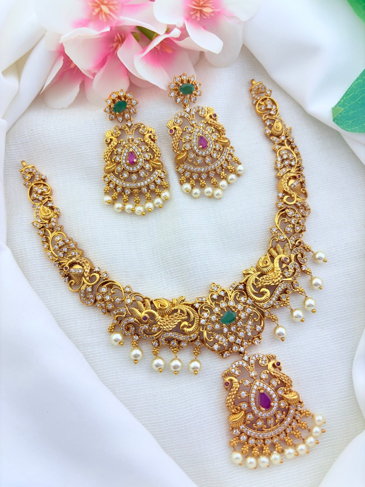 Elegant Premium matte finish necklace and earrings adorned with classic stones and pearl drops