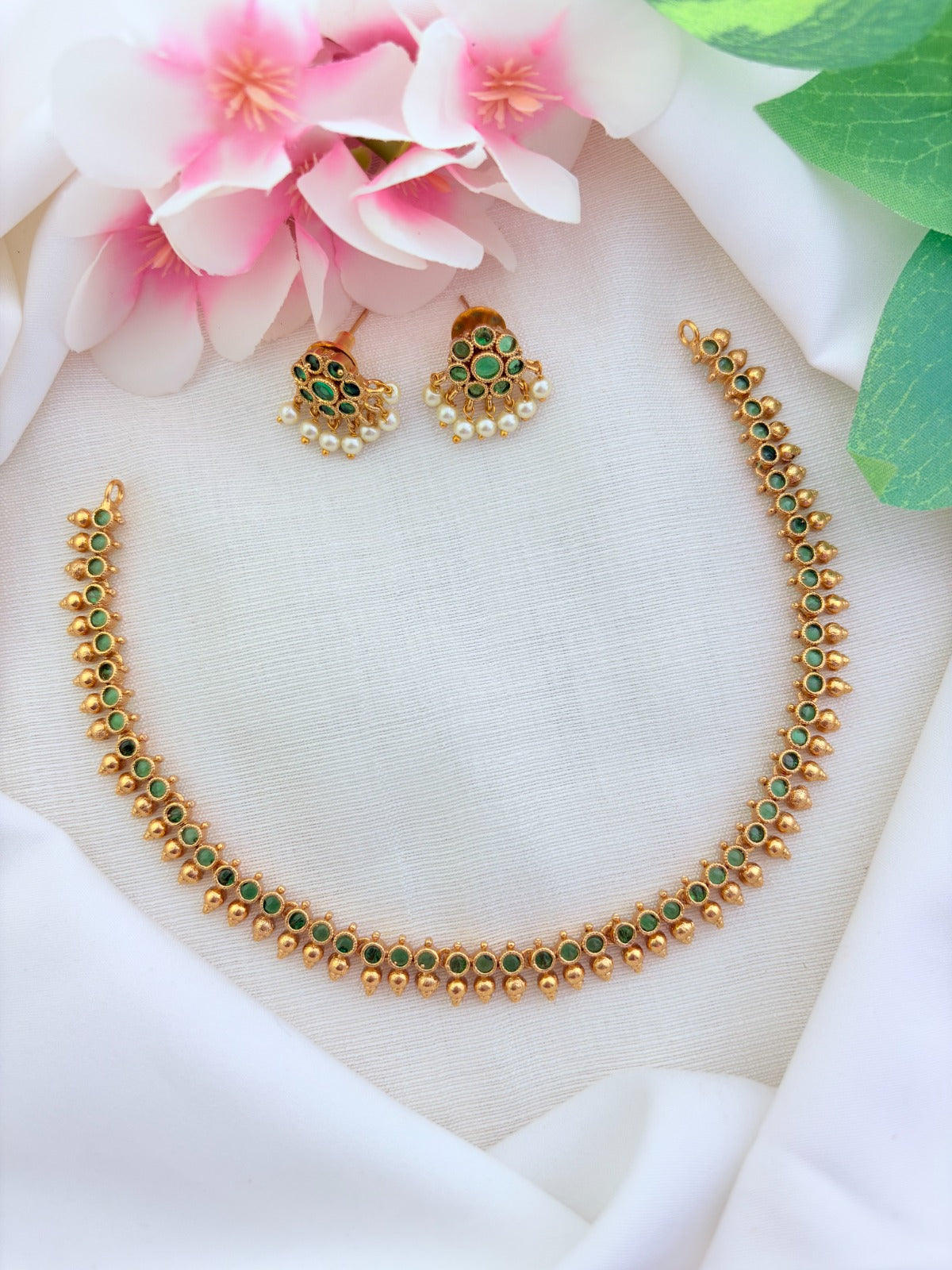 Premium matte finish AD stone necklace and earrings beautifully crafted with pearl drops